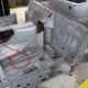 One freshly split Miata chassis.